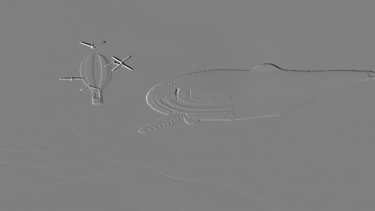 The whale, balloon and birds pressed into a flat gray relief, only their raised outlines catching the light